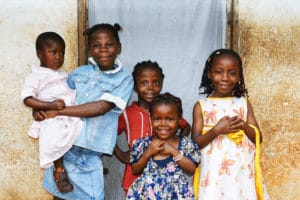 African kids all sisters smiling